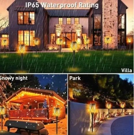 Вуличний ліхтар на сонячній батареї з ефектом полум'я Solar flame led light sensor activated 52 см 0011 фото