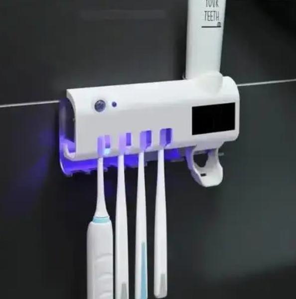 Настенный держатель диспенсер для зубной пасты и щеток Toothbrush sterilizer с ультрафиолетовой дезинфекцией 0258 фото